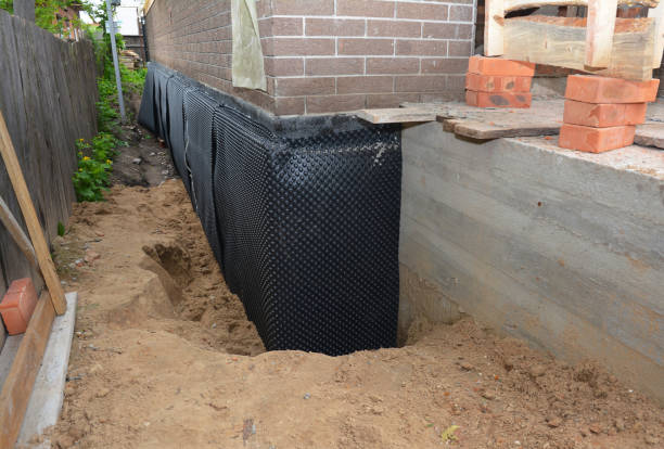 Happy homeowners after waterproofing job in Chesterton